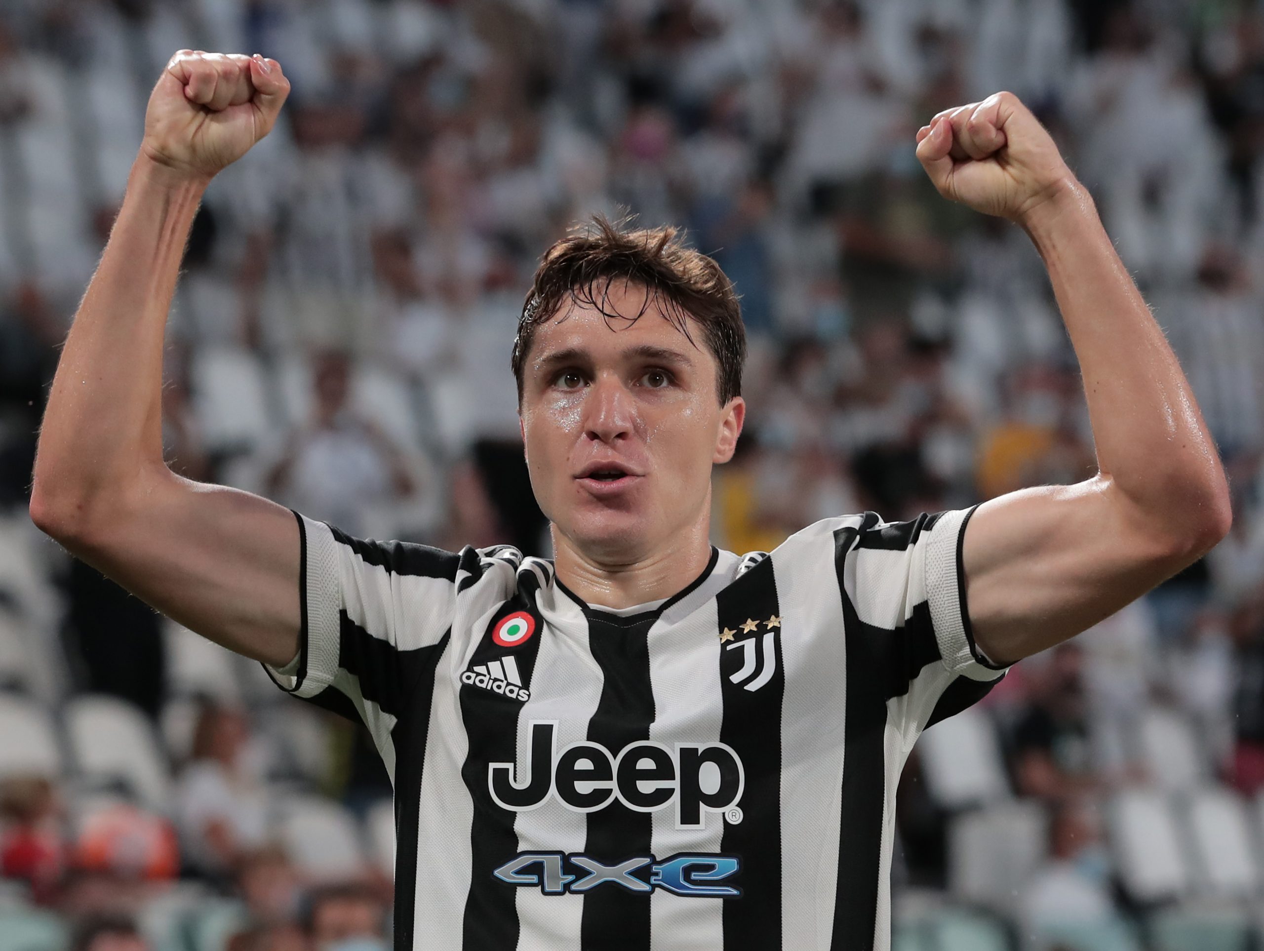TURIN, ITALY - AUGUST 14: Federico Chiesa of Juventus celebrates after his team-mate Paulo Dybala scored during the pre-season friendly match between Juventus and Atalanta BC at Allianz Stadium on August 14, 2021 in Turin, Italy. (Photo by Emilio Andreoli/Getty Images)