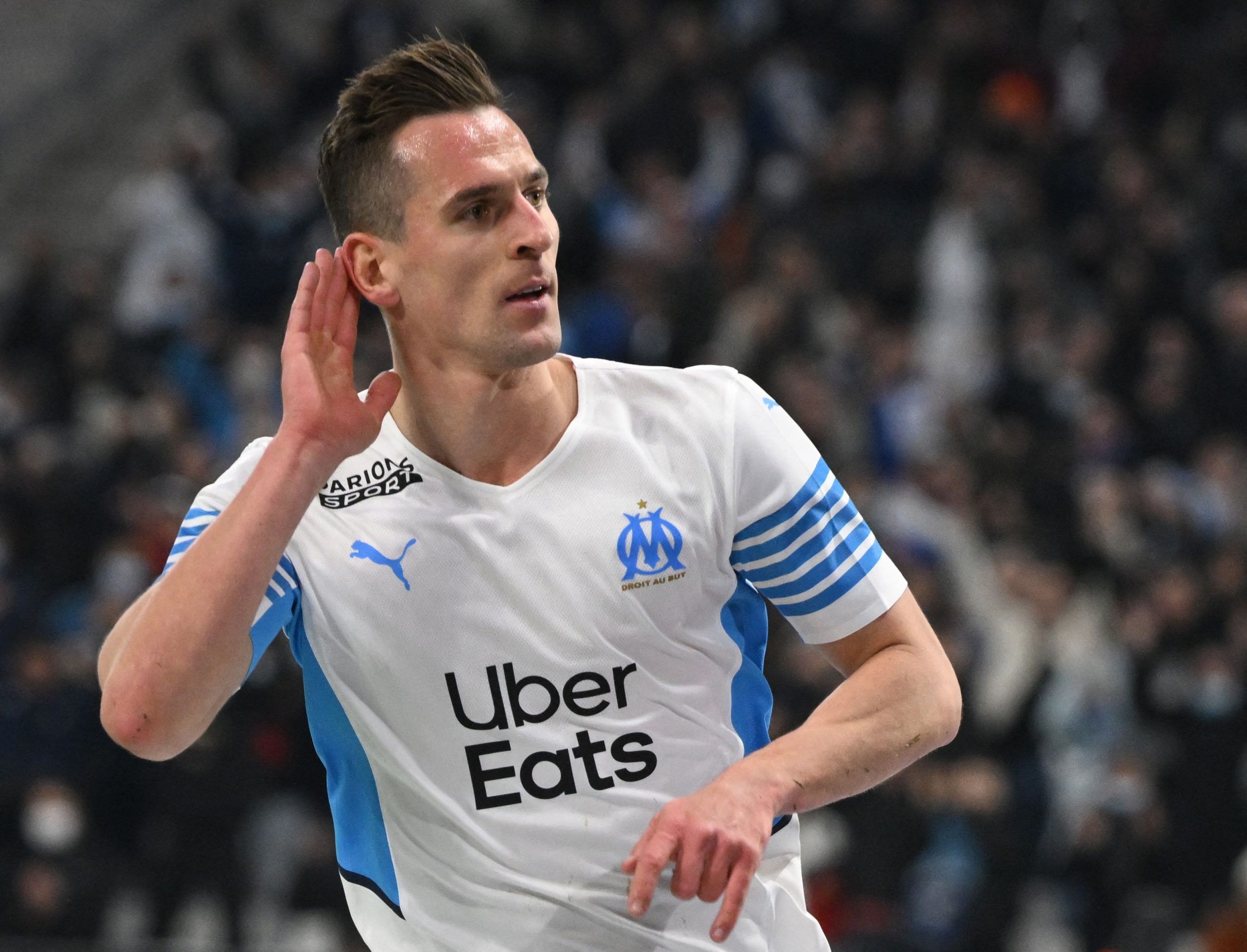 Marseille's Polish forward Arkadiusz Milik celebrates scoring his team's second goal during the French L1 football match between Olympique Marseille (OM) and SCO Angers at Stade Velodrome in Marseille, southern France, on February 4, 2022. (Photo by Nicolas TUCAT / AFP) (Photo by NICOLAS TUCAT/AFP via Getty Images)