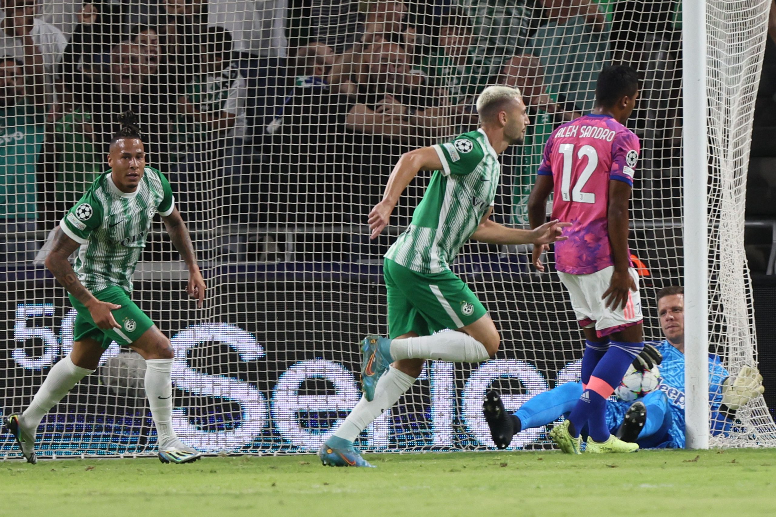 Maccabi Haifa's Israeli midfielder Omer Atzili (C) runs to celebrate after scoring during the UEFA Champions League group H football match between Israel's Maccabi Haifa and Italy's Juventus at the Sammy Ofer stadium in the city of Haifa on October 11, 2022. (Photo by JACK GUEZ / AFP) (Photo by JACK GUEZ/AFP via Getty Images)