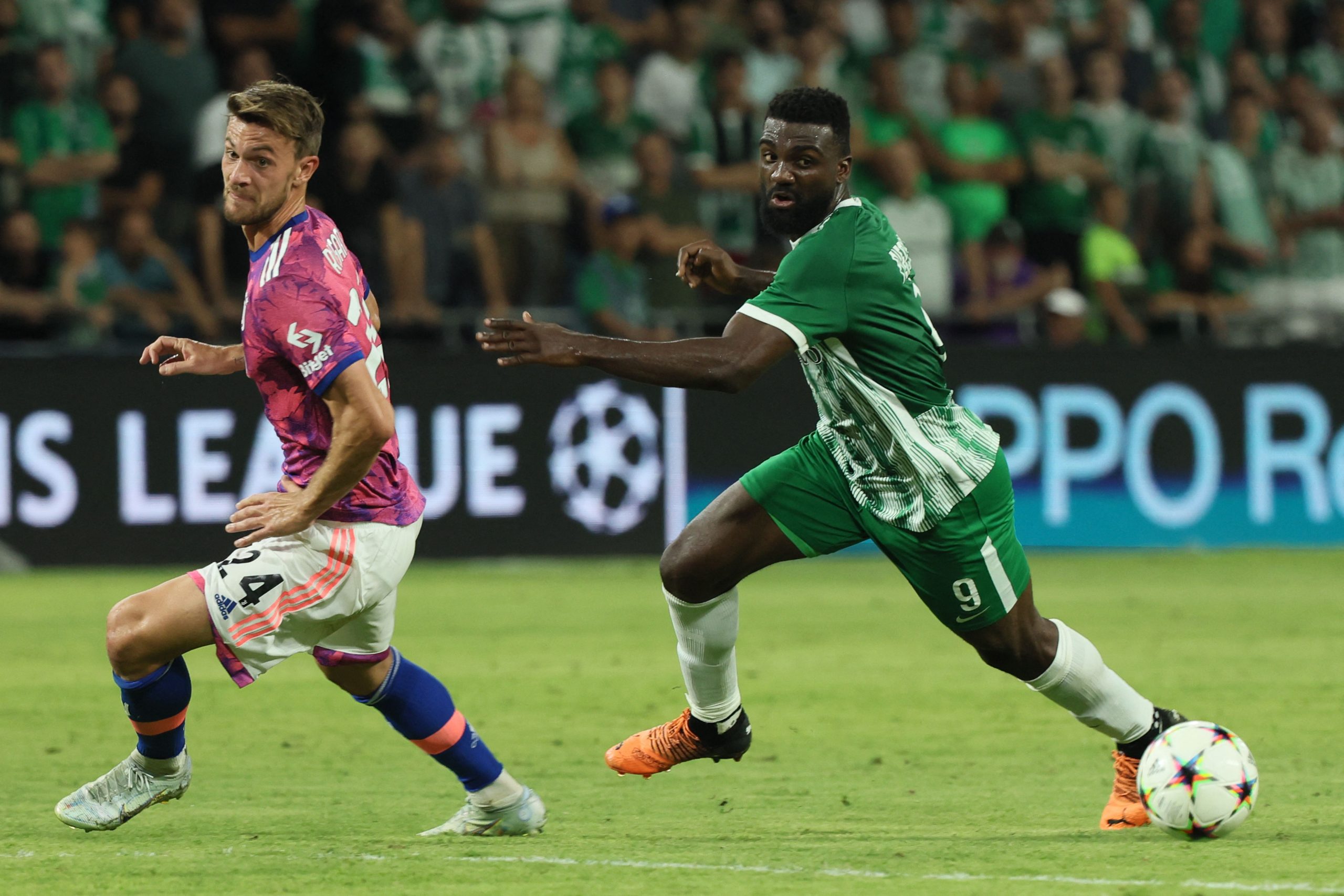 Juventus' Italian defender Daniele Rugani (L) vies for the ball with Maccabi Haifa's Haitian forward Frantzdy Pierrot during the UEFA Champions League group H football match between Israel's Maccabi Haifa and Italy's Juventus at the Sammy Ofer stadium in the city of Haifa on October 11, 2022. (Photo by JACK GUEZ / AFP) (Photo by JACK GUEZ/AFP via Getty Images)