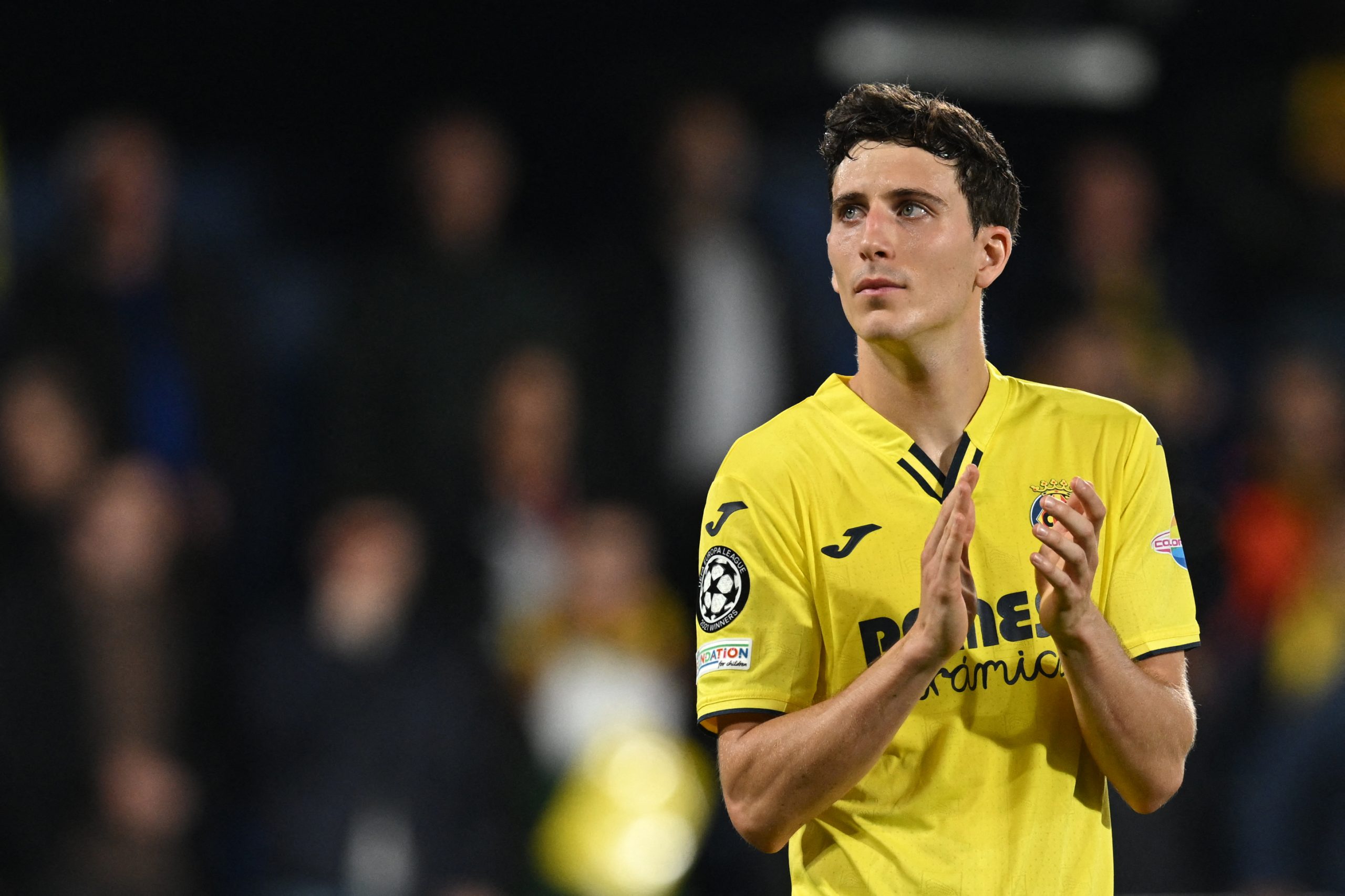 Villarreal's Spanish defender Pau Torres applauds supporters at the end of the UEFA Champions League semi final second leg football match between Liverpool and Villarreal CF at La Ceramica stadium in Vila-real on May 3, 2022. (Photo by Paul ELLIS / AFP) (Photo by PAUL ELLIS/AFP via Getty Images)