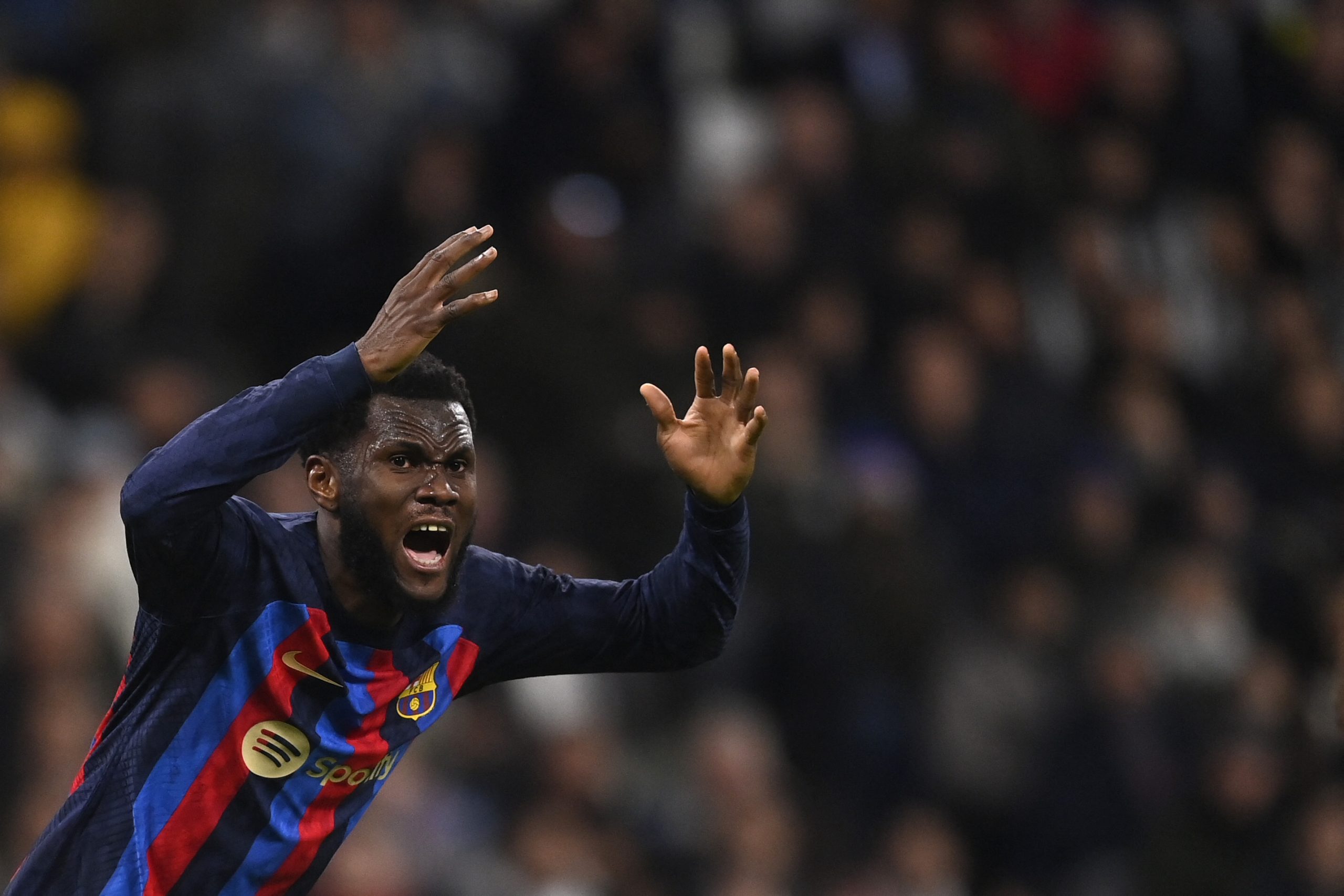 Barcelona's Ivorian midfielder Franck Kessie reacts during the Copa del Rey (King's Cup) semi final first leg football match between Real Madrid CF and FC Barcelona at the Santiago Bernabeu stadium in Madrid on March 2, 2023. (Photo by OSCAR DEL POZO / AFP) (Photo by OSCAR DEL POZO/AFP via Getty Images)