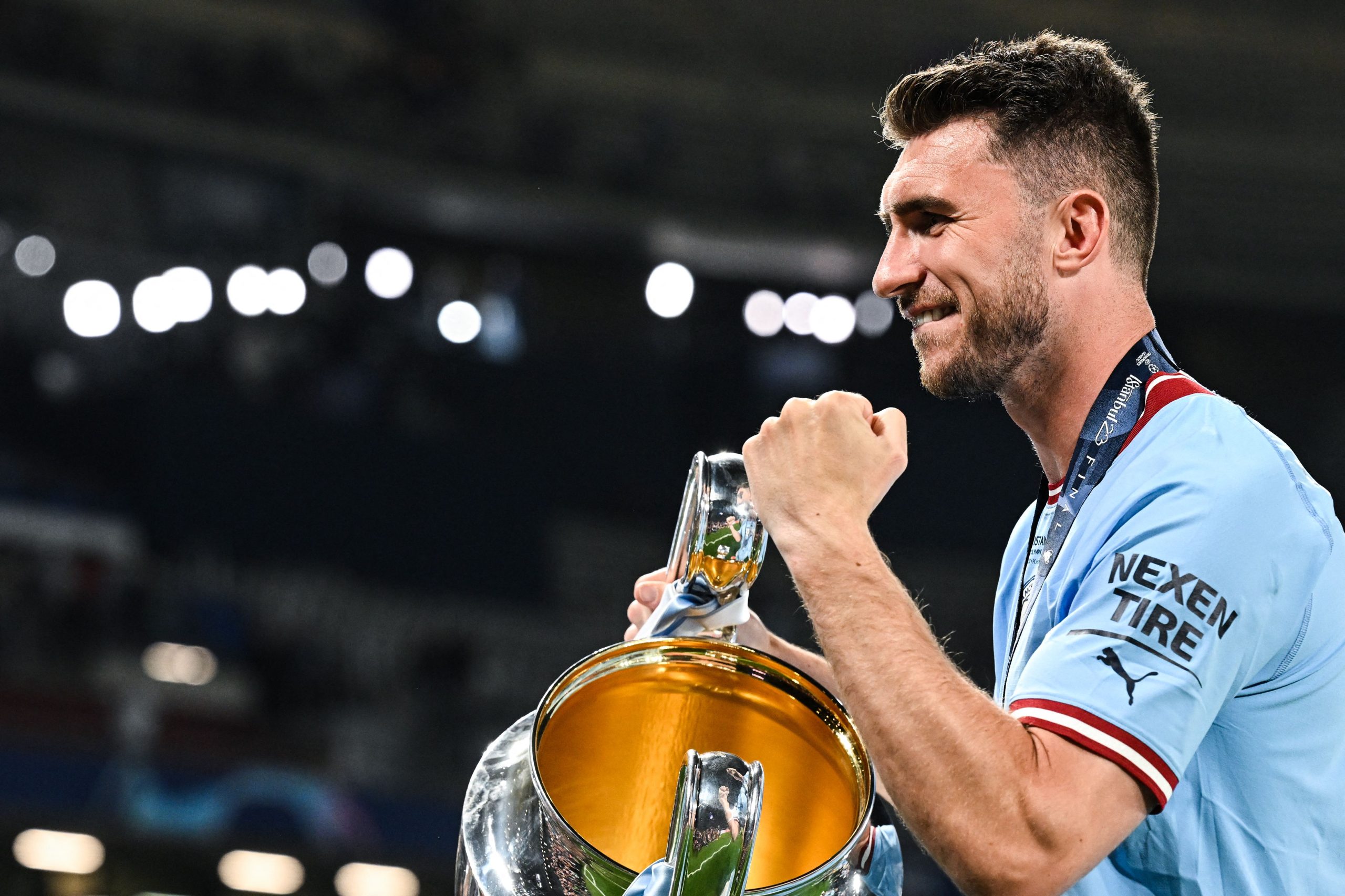 Manchester City's French defender #14 Aymeric Laporte poses with the European Cup trophy as they celebrate winning the UEFA Champions League final football match between Inter Milan and Manchester City at the Ataturk Olympic Stadium in Istanbul, on June 10, 2023. Manchester City won the match 1-0. (Photo by Paul ELLIS / AFP) (Photo by PAUL ELLIS/AFP via Getty Images)