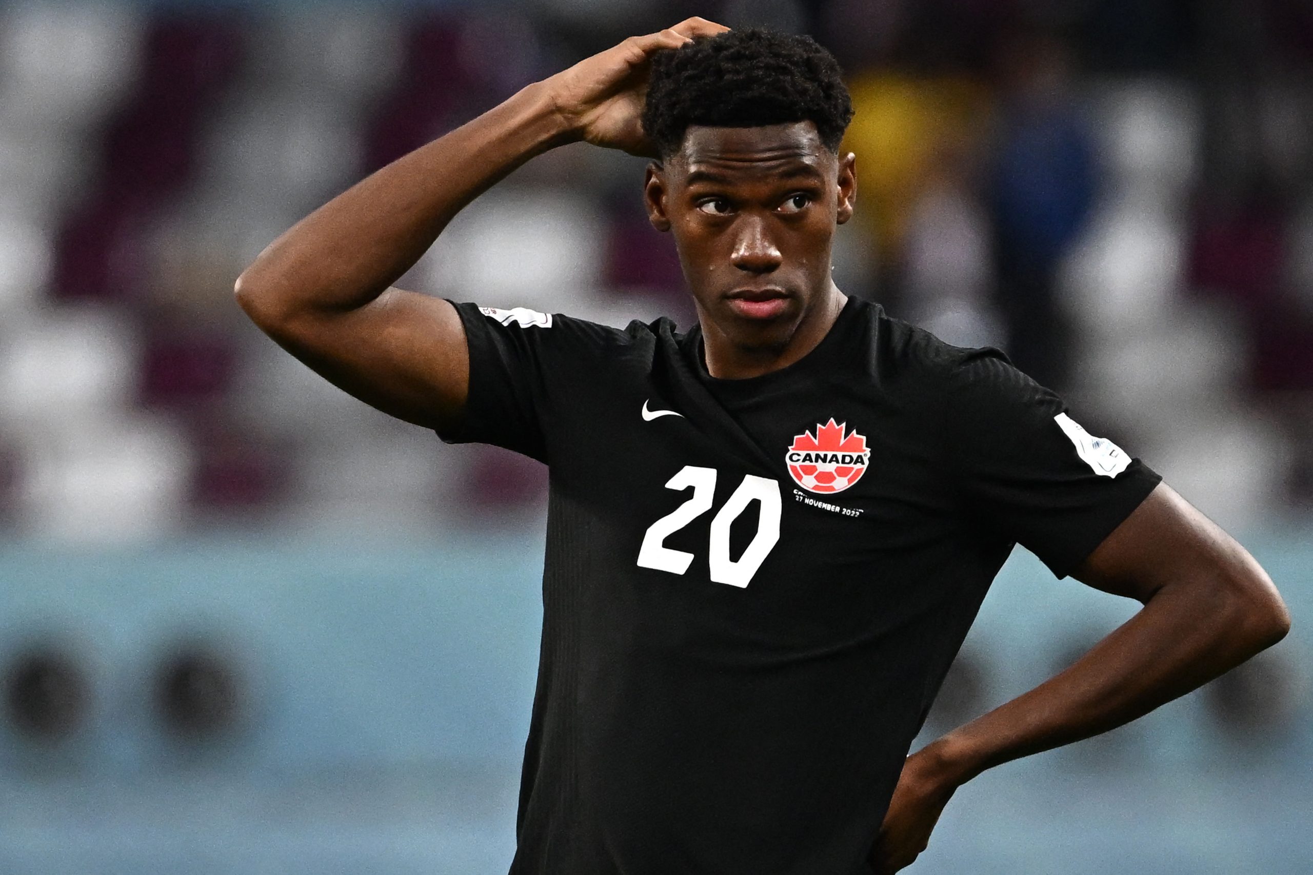 Canada's forward #20 Jonathan David reacts after Croatia won the Qatar 2022 World Cup Group F football match between Croatia and Canada at the Khalifa International Stadium in Doha on November 27, 2022. (Photo by Anne-Christine POUJOULAT / AFP) (Photo by ANNE-CHRISTINE POUJOULAT/AFP via Getty Images)