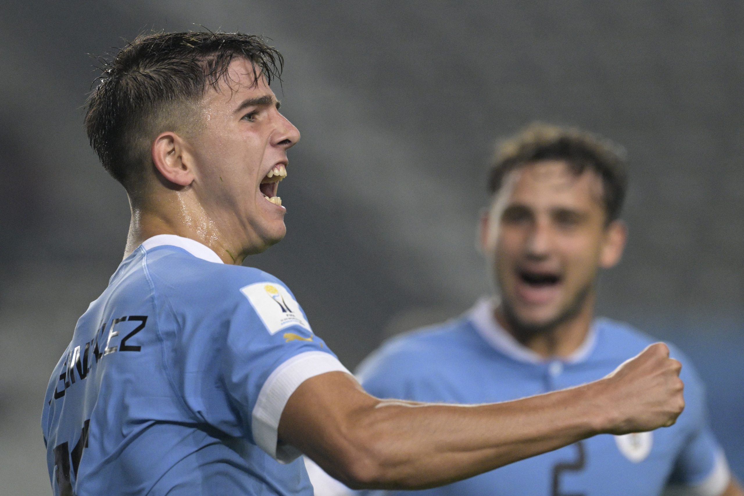 Uruguay's defender Facundo Gonzalez (L) celebrates next to teammate defender Sebastian Boselli after scoring his team's third goal during the Argentina 2023 U-20 World Cup Group E football match between Uruguay and Iraq at the Estadio Unico Diego Maradona stadium in La Plata, Buenos Aires Province, Argentina, on May 22, 2023. (Photo by JUAN MABROMATA / AFP) (Photo by JUAN MABROMATA/AFP via Getty Images)