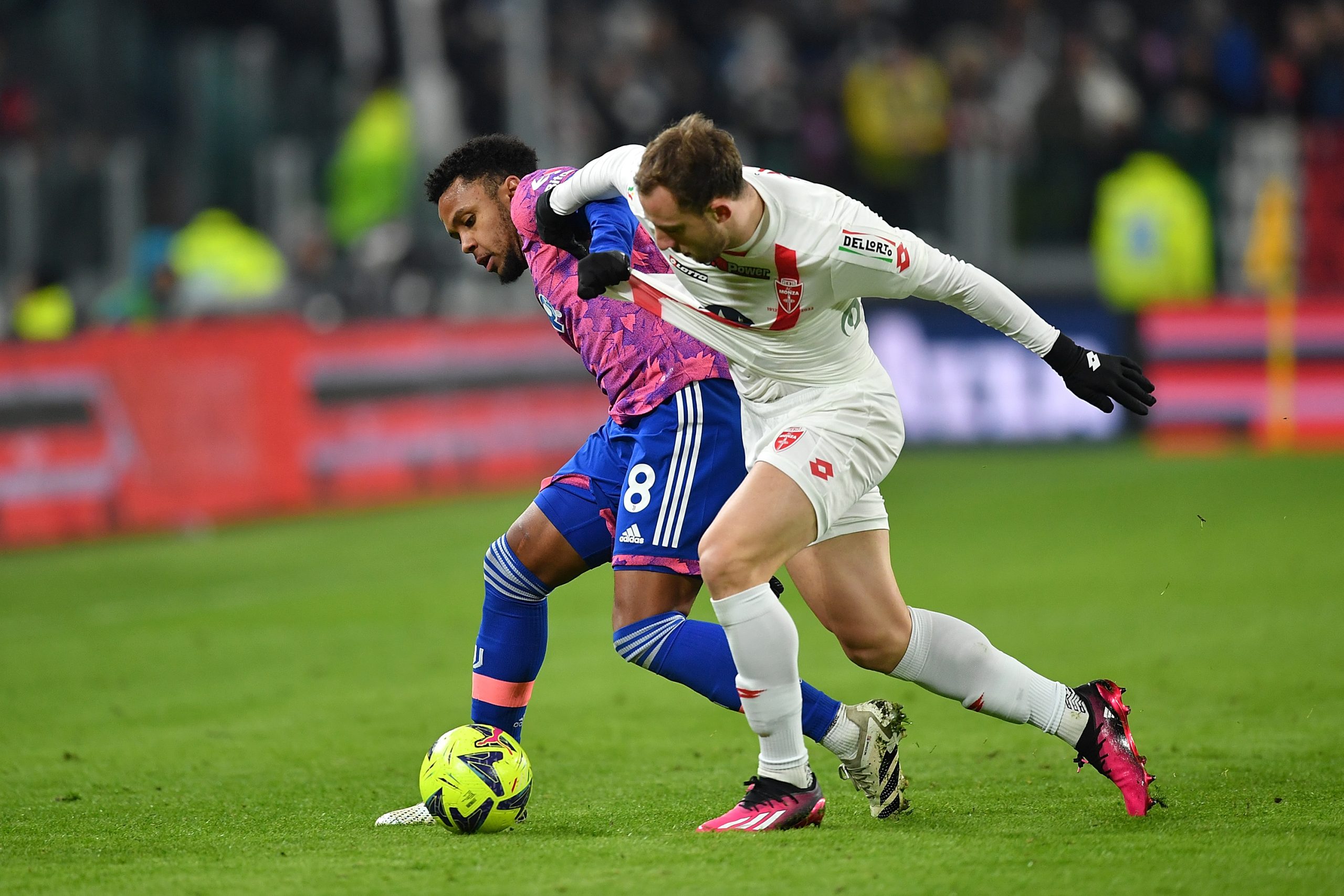 TURIN, ITALY - JANUARY 19: Weston Mckennie of Juventus competes with Carlos Augusto of Monza during the Coppa Italia match between Juventus and Monza at Juventus Stadium on January 19, 2023 in Turin, Italy. (Photo by Valerio Pennicino/Getty Images)