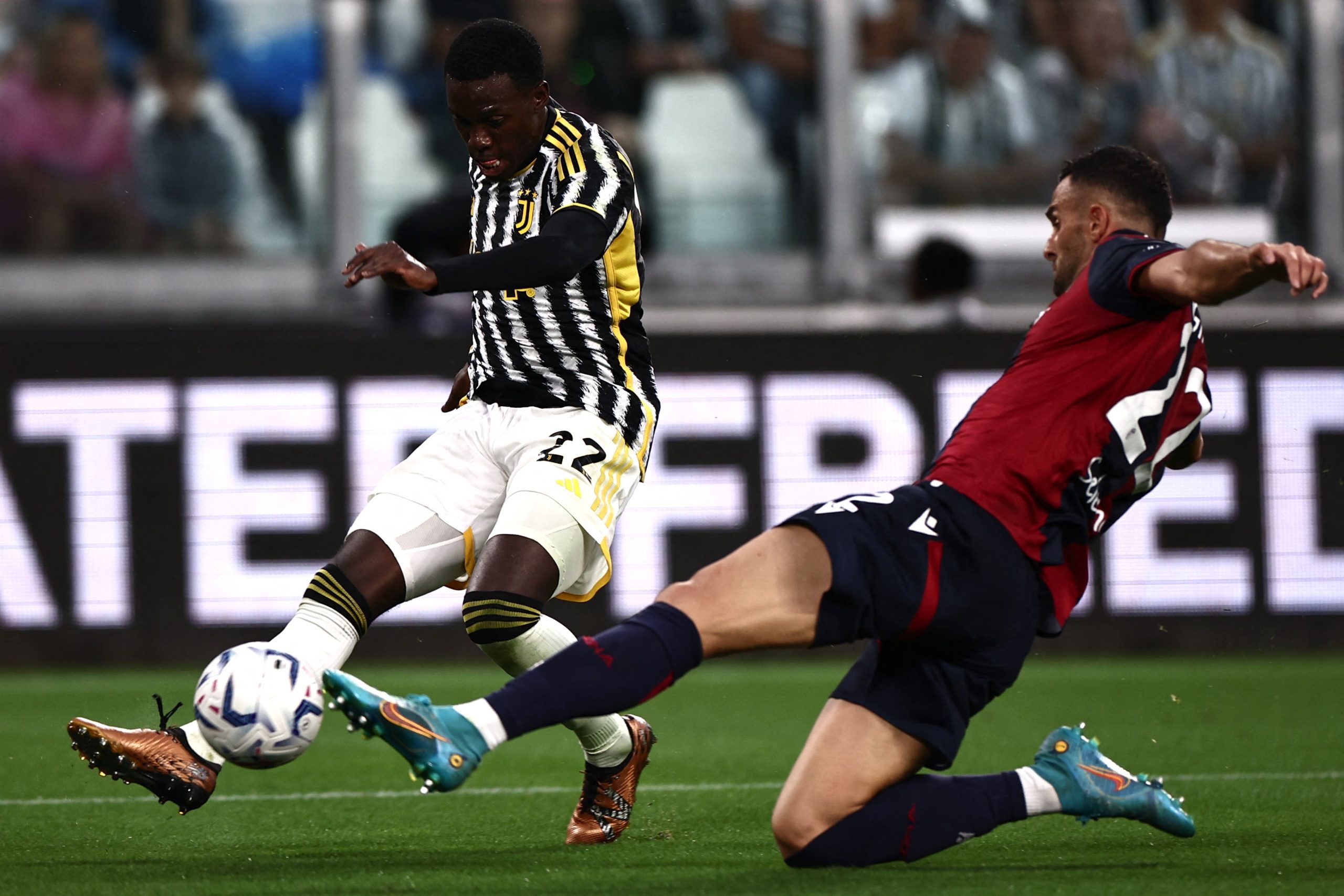 Juventus' American forward #22 Tim Weah fights for the ball with Bologna's Greek defender Charalampos Lykogiannis during the Italian Serie A football match Juventus vs Bologna on August 27, 2023 at the "Allianz Stadium" in Turin. (Photo by MARCO BERTORELLO / AFP) (Photo by MARCO BERTORELLO/AFP via Getty Images)