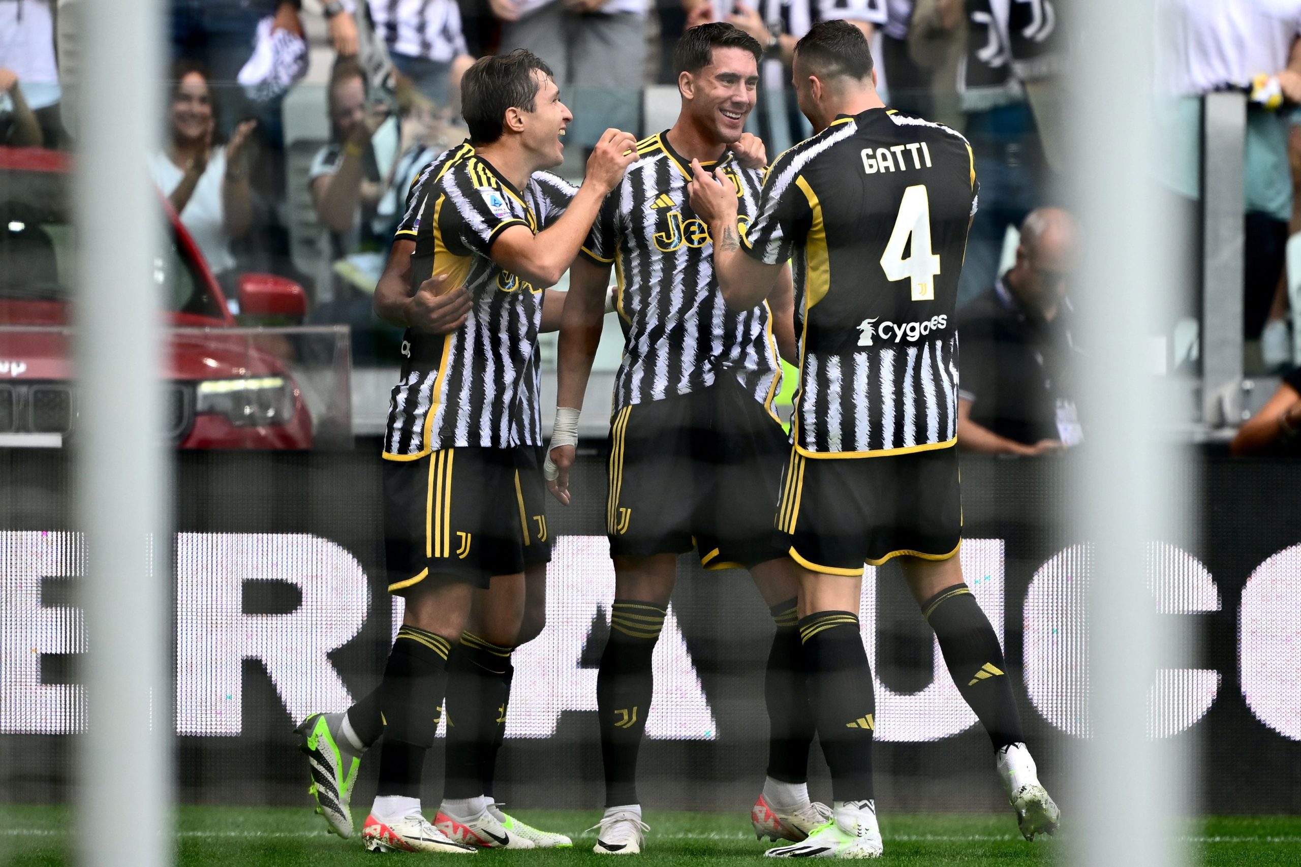 Juventus' Serbian forward #09 Dusan Vlahovic (C) celebrates with teammates after scoring his team's first a goal during the Italian Serie A football match between Juventus and Lazio at the "Allianz Stadium" in Turin, on September 16, 2023. (Photo by MARCO BERTORELLO / AFP) (Photo by MARCO BERTORELLO/AFP via Getty Images)