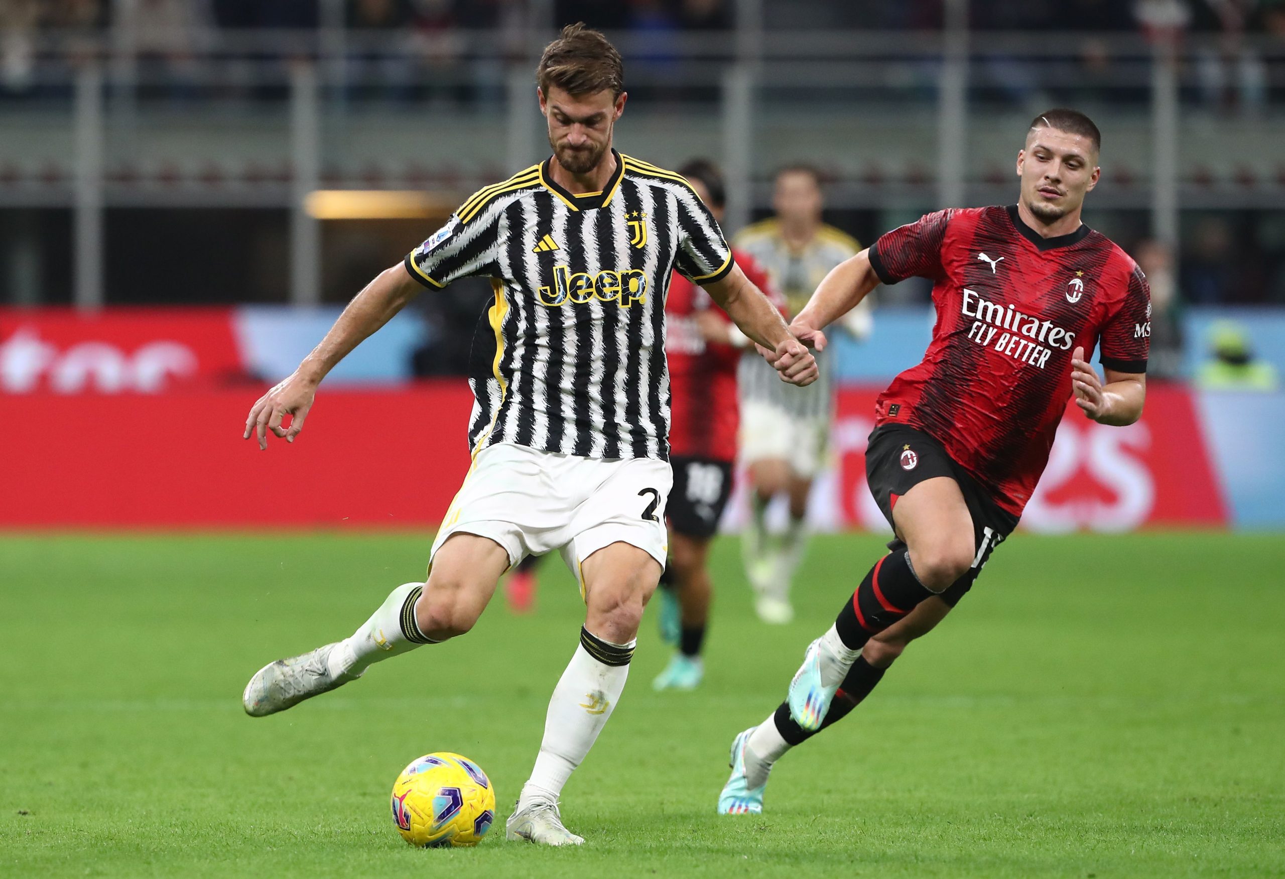 MILAN, ITALY - OCTOBER 22: Daniele Rugani of Juventus FC is challenged by Luka Jovic of AC Milan during the Serie A TIM match between AC Milan and Juventus FC at Stadio Giuseppe Meazza on October 22, 2023 in Milan, Italy. (Photo by Marco Luzzani/Getty Images)