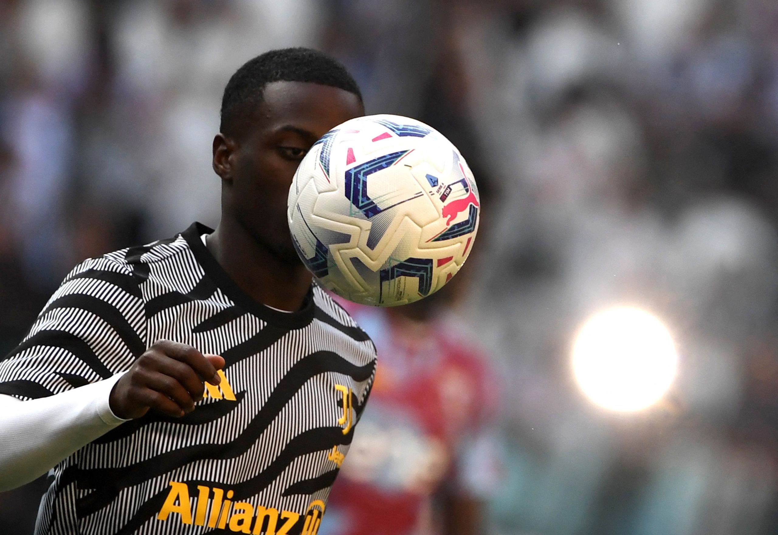 Juventus' US forward #22 Timothy Weah eyes the ball during the warm up prior to the Italian Serie A football match between Juventus and Torino, at Allianz stadium in Turin, on October 7, 2023. (Photo by Isabella BONOTTO / AFP) (Photo by ISABELLA BONOTTO/AFP via Getty Images)