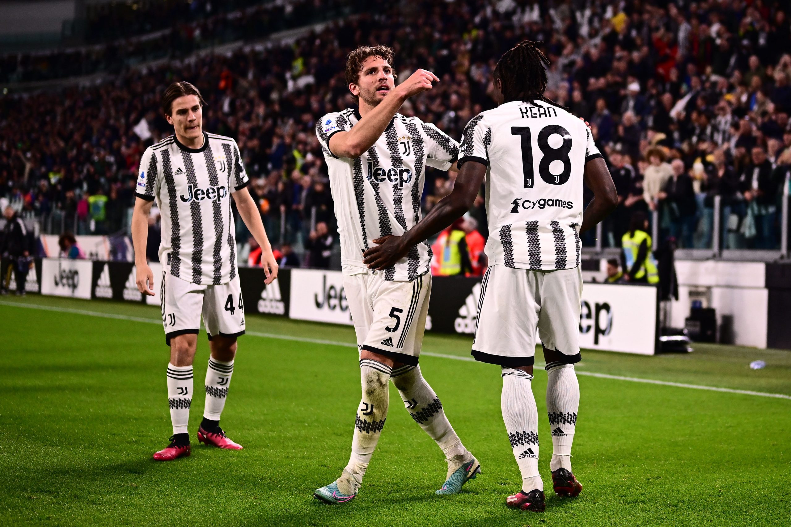 Juventus' Italian forward Moise Kean (R) celebrates with Juventus' Italian midfielder Manuel Locatelli (C) and Juventus' Italian midfielder Nicolo Fagioli after opening the scoring during the Italian Serie A football match between Juventus and Hellas Verona on April 1, 2023 at the Juventus stadium in Turin. (Photo by Marco BERTORELLO / AFP) (Photo by MARCO BERTORELLO/AFP via Getty Images)