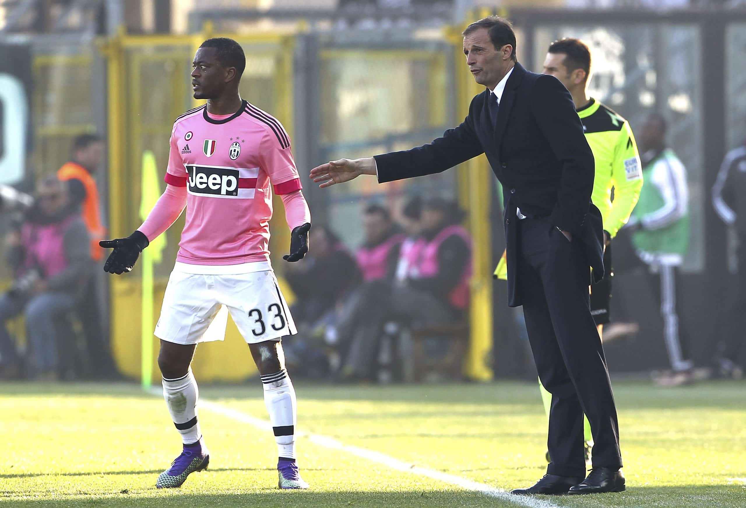 BERGAMO, ITALY - MARCH 06: Juventus FC head coach Massimiliano Allegri (R) gives instructions to his player Patrice Evra (L) during the Serie A match between Atalanta BC and Juventus FC at Stadio Atleti Azzurri d'Italia on March 6, 2016 in Bergamo, Italy. (Photo by Marco Luzzani/Getty Images)