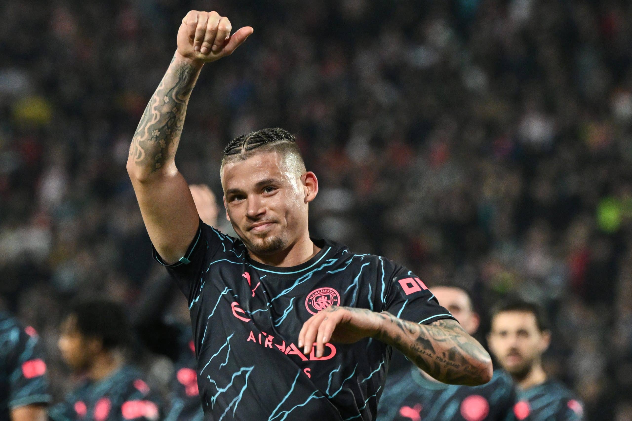 Manchester City's English midfielder #04 Kalvin Phillips celebrates scoring his team's third goal after a penalty shot during the UEFA Champions League Group G day 6 group stage football match between Crvena Zvezda (Red Star Belgrade) and Manchester City at the Red Star stadium in Belgrade, on December 13, 2023. (Photo by ANDREJ ISAKOVIC / AFP) (Photo by ANDREJ ISAKOVIC/AFP via Getty Images)