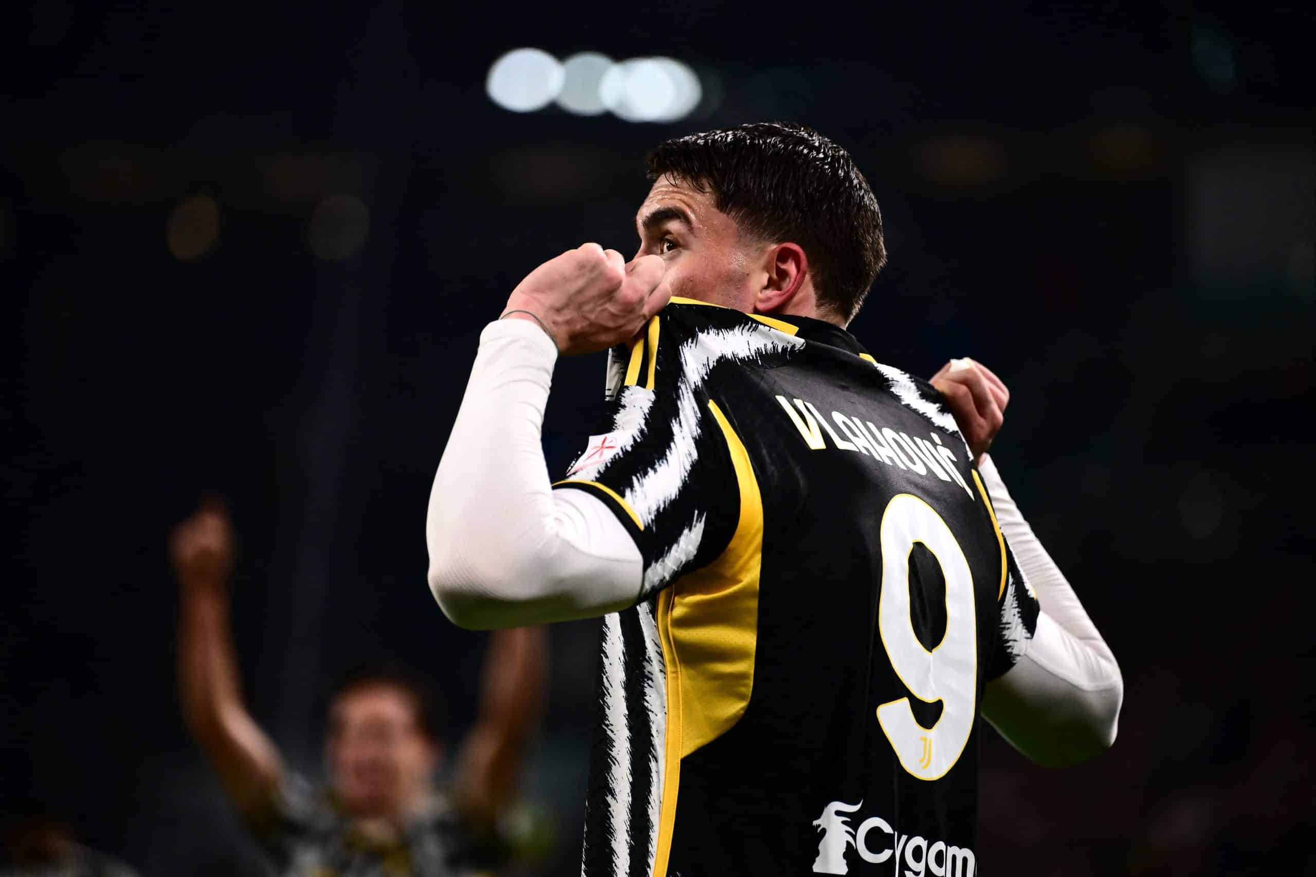 Juventus' Serbian forward #09 Dusan Vlahovic holds the back of his shirt as he celebrates scoring Juventus' first goal during the Italian Serie A football match between Juventus and Inter Milan at the Allianz Stadium in Turin, on November 26, 2023. (Photo by MARCO BERTORELLO / AFP) (Photo by MARCO BERTORELLO/AFP via Getty Images)