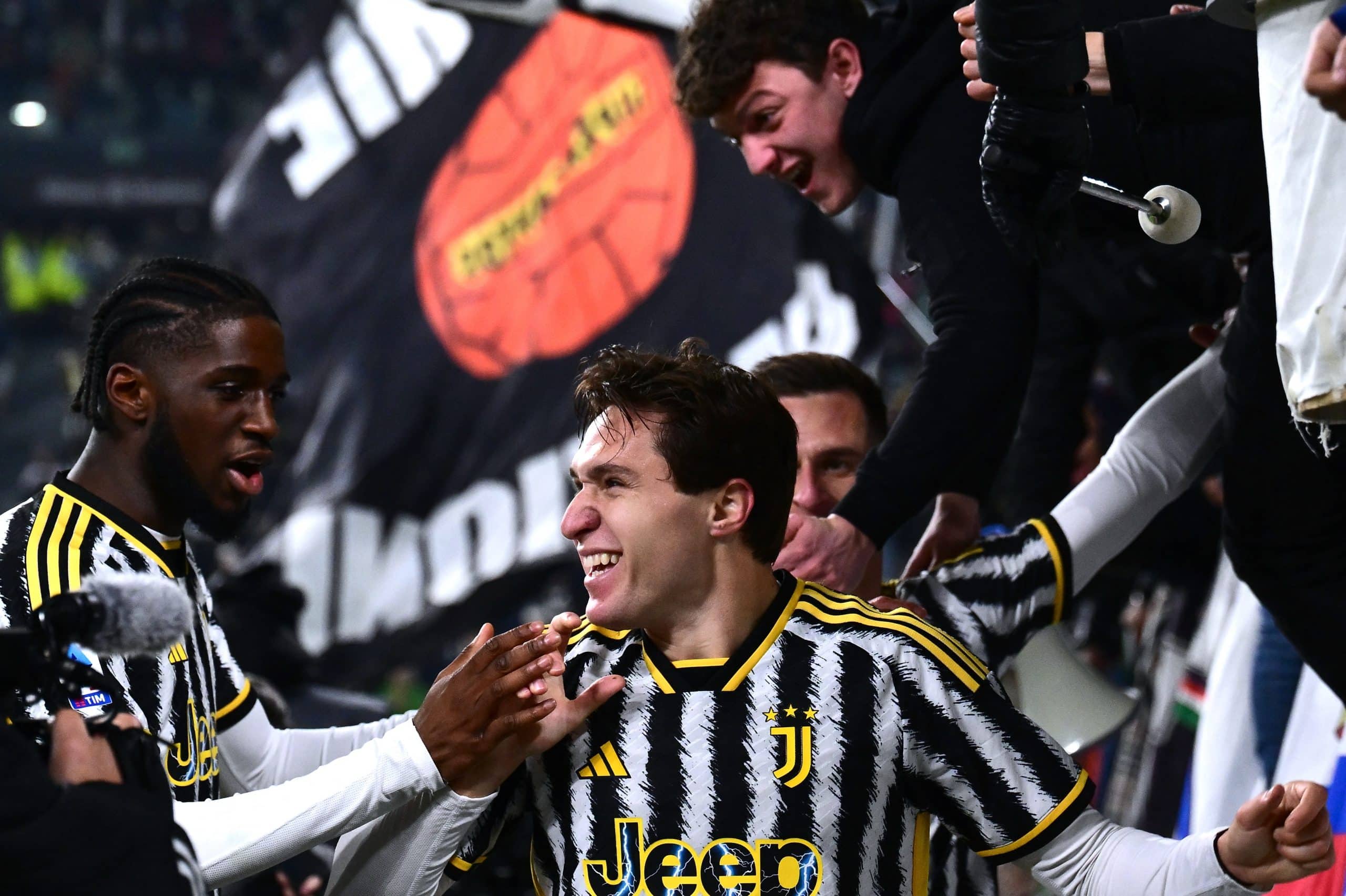 Juventus' Italian forward Federico Chiesa celebrates with team mates after scoring a goal during the Italian Serie A football match Juventus vs Sassuolo on January 16, 2024 at the Allianz Stadium in Turin. (Photo by MARCO BERTORELLO / AFP) (Photo by MARCO BERTORELLO/AFP via Getty Images)