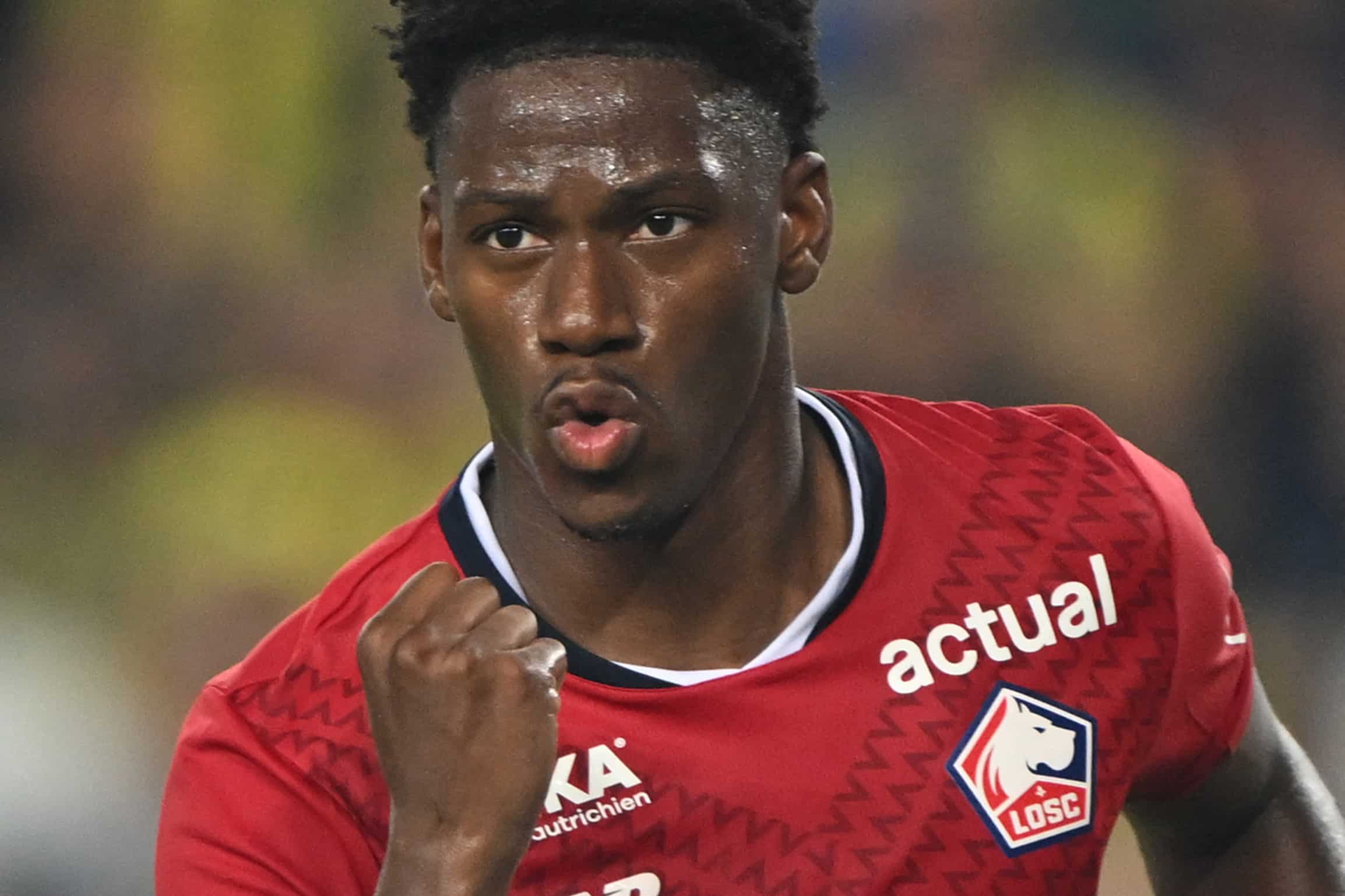 Lille's Canadian forward #09 Jonathan David celebrates scoring his team's first goal from the penalty spot during the UEFA Champions League 3rd Qualifying Round second leg football match between Fenerbahce and Lille LOSC at the Fenerbahce Sukrü Saracoglu Stadium in Istanbul on August 13, 2024. (Photo by Ozan KOSE / AFP) (Photo by OZAN KOSE/AFP via Getty Images)