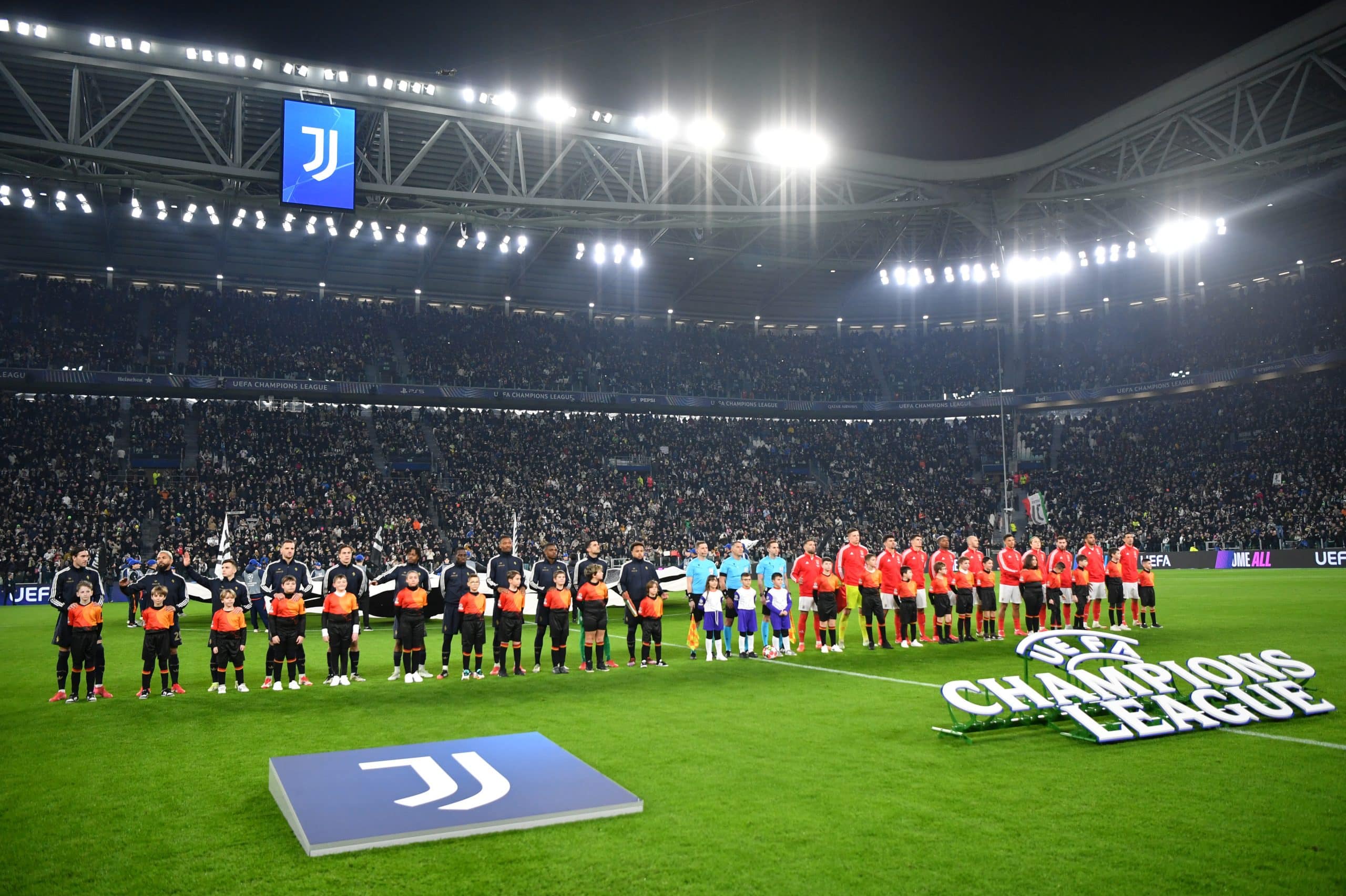 TURIN, ITALY - JANUARY 29: Players, match officials and mascots line up prior to the UEFA Champions League 2024/25 League Phase MD8 match between Juventus and SL Benfica at Juventus Stadium on January 29, 2025 in Turin, Italy. (Photo by Valerio Pennicino/Getty Images)