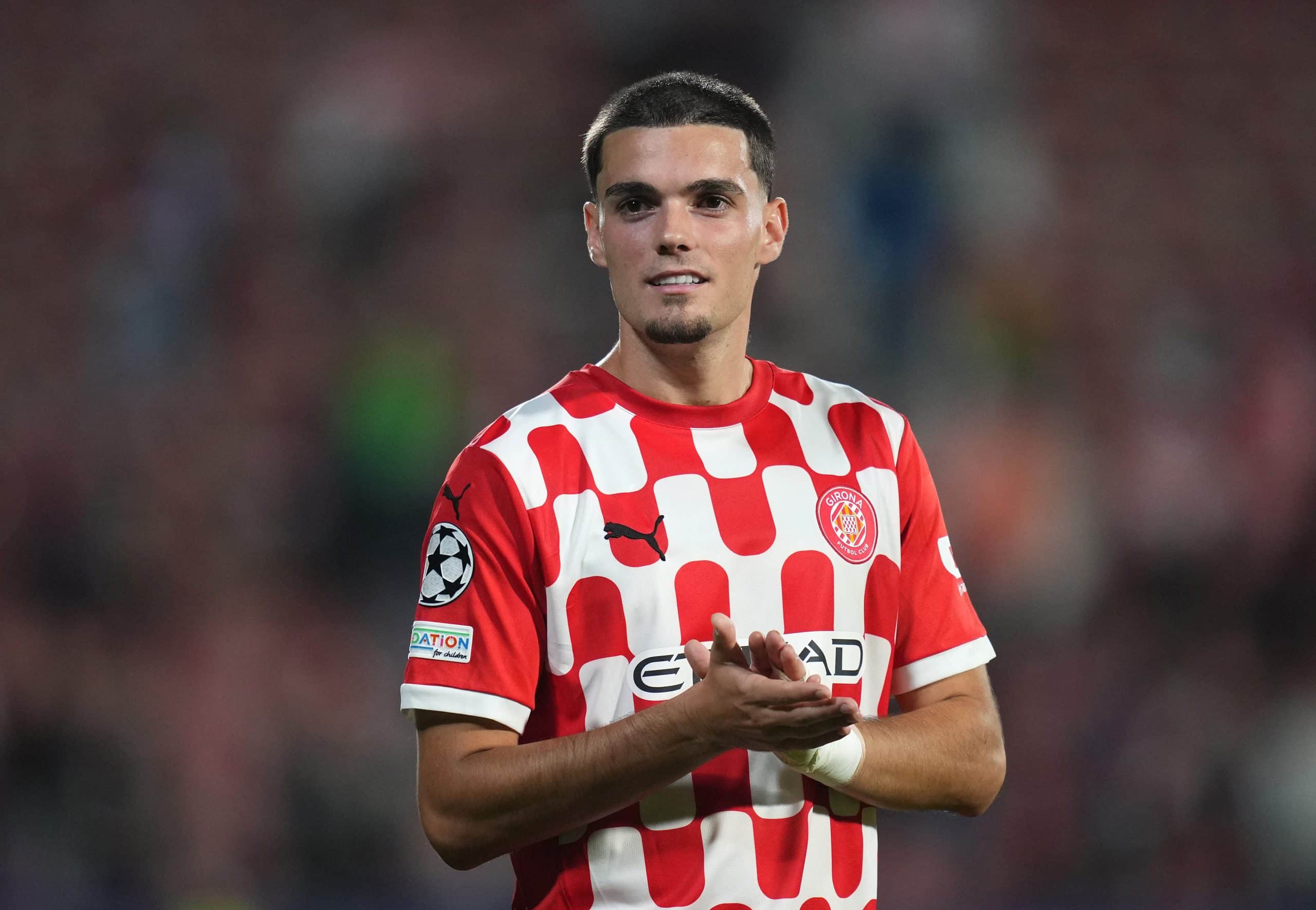 GIRONA, SPAIN - OCTOBER 22: Miguel Gutierrez of Girona FC applauds the fans at full-time following the team's victory in the UEFA Champions League 2024/25 League Phase MD3 match between Girona FC and SK Slovan Bratislava at Montilivi Stadium on October 22, 2024 in Girona, Spain. (Photo by Alex Caparros/Getty Images)