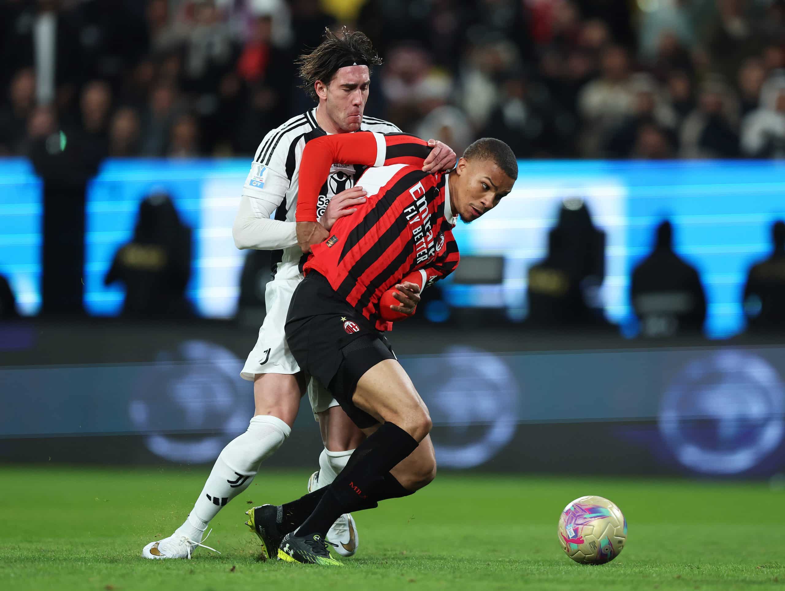 RIYADH, SAUDI ARABIA - JANUARY 03: Malick Thiaw of AC Milan is challenged by Dusan Vlahovic of Juventus during the Italian Super Cup Semi-Final match between AC Milan and Juventus at Al Awwal Park on January 03, 2025 in Riyadh, Saudi Arabia. (Photo by Yasser Bakhsh/Getty Images)