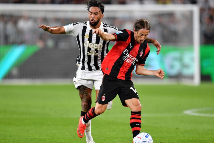 Nico Gonzalez aux prises avec Luka Modric lors de Juventus - Milan (Photo by Valerio Pennicino/Getty Images)